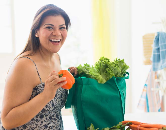 woman holding vegetables